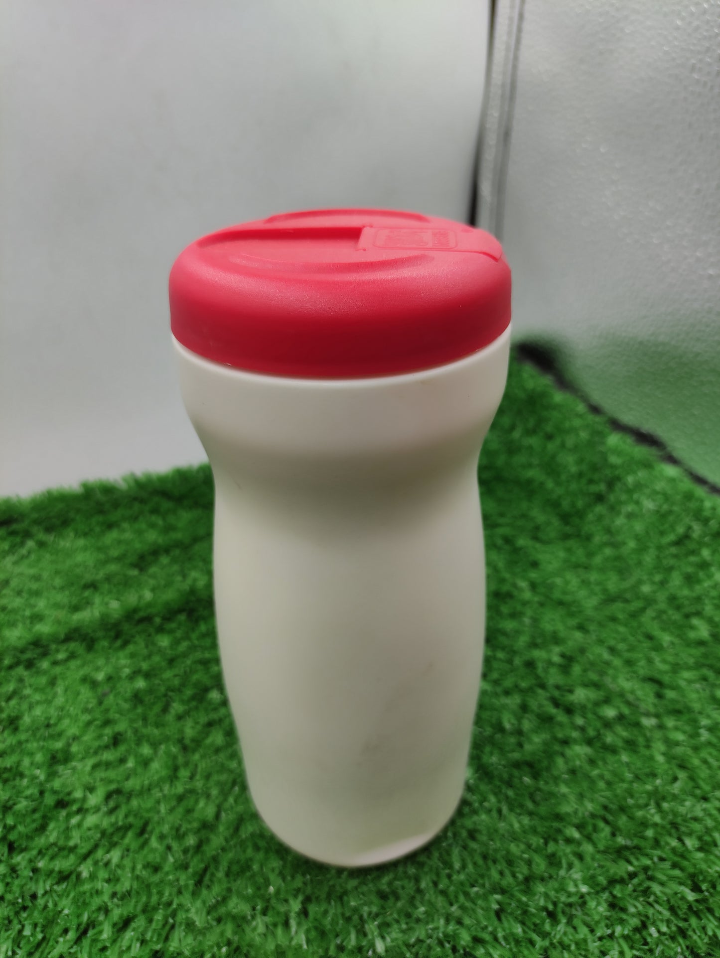 WHITE PLASTIC BOTTLE