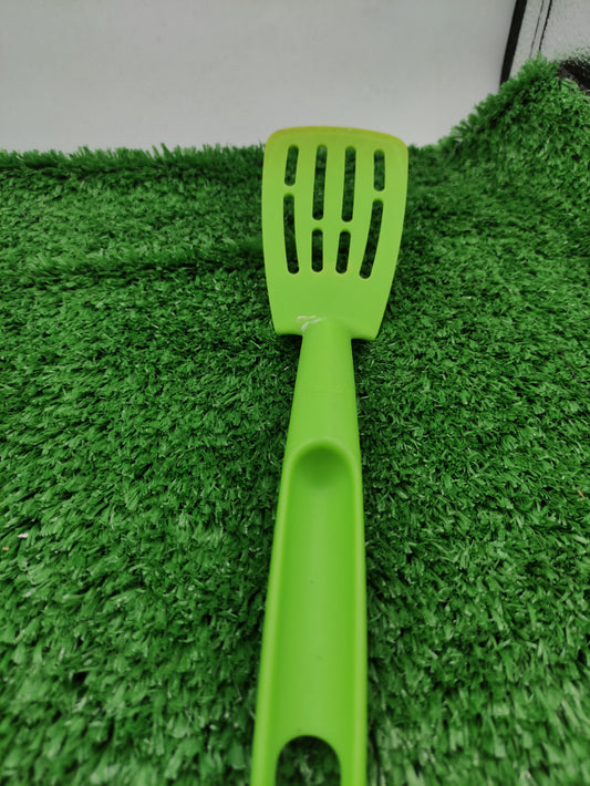 BRIGHT GREEN PLASTIC SPATULA AND SERVING FOOD