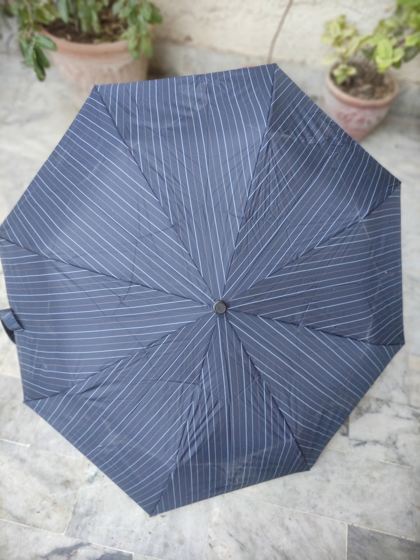MOONBAT DUNAMIS FOLDING UMBRELLA WITH A STRIPED PATTERN