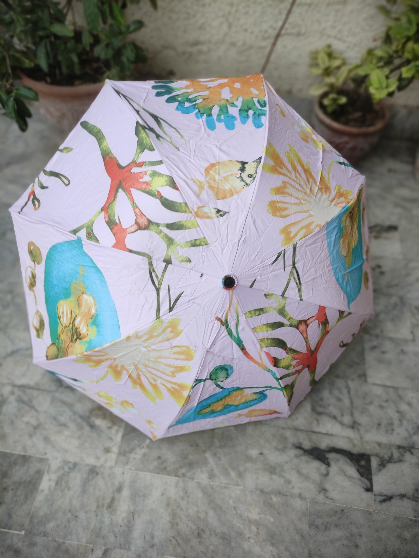 FOLDING UMBRELLA WITH A MULTI COLOUR FLOWER PATTERN